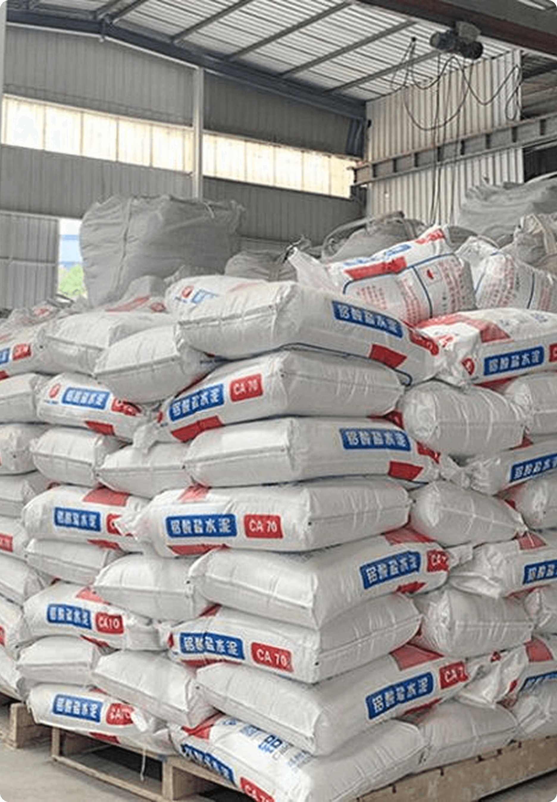 Bags of cement and other building materials stacked high